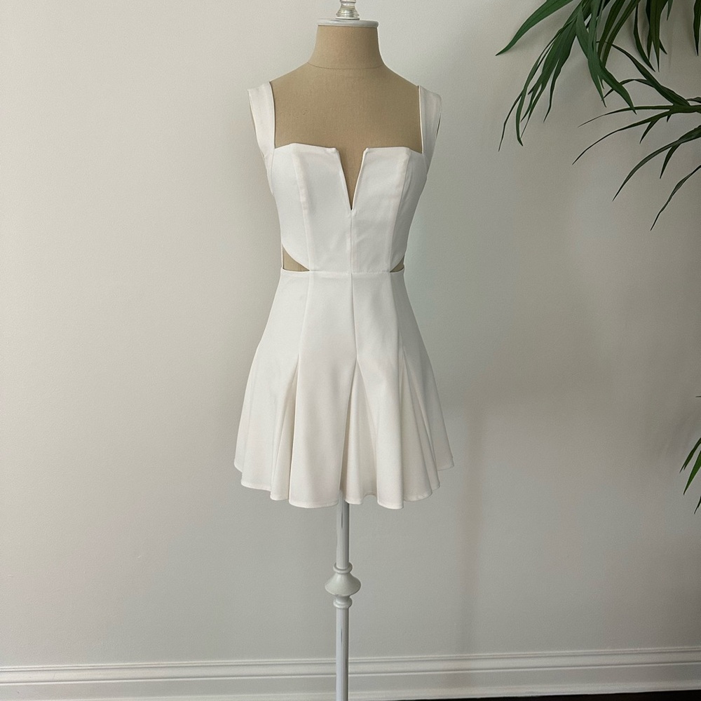 NBD White mini dress with cutout. Size 2